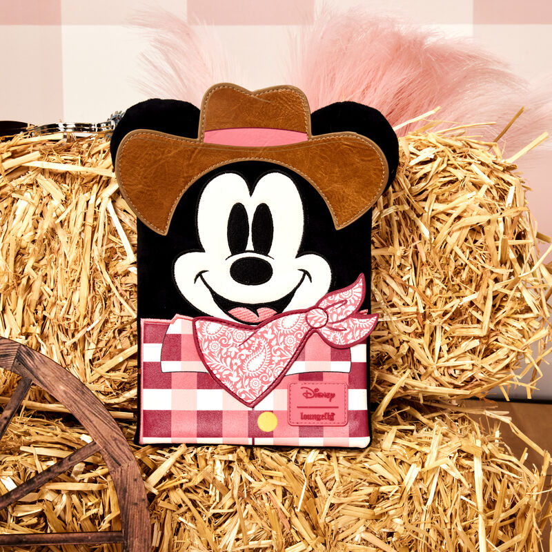 Loungefly Western Mickey Mouse Cosplay Plush Refillable Stationery Journal sitting on a hay bale against a pale pink plaid background